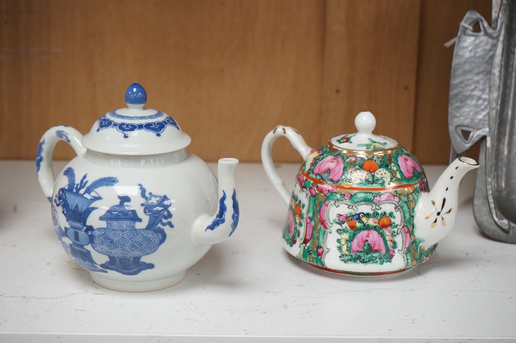 Two Chinese teapots comprising a blue and white and famille rose example, largest 16cm wide
